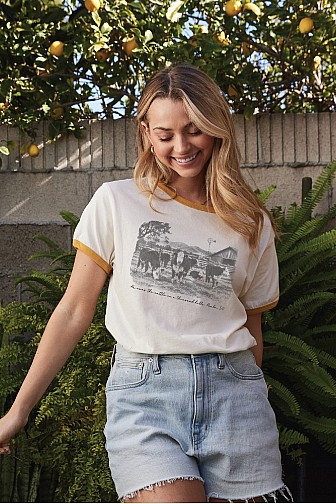 HE OWNS THE CATTLE ON A THOUSAND HILLS RINGER GRAPHIC TOP