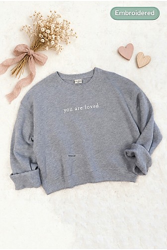 EMBROIDERED YOU ARE LOVED MID CROPPED SWEATSHIRT 